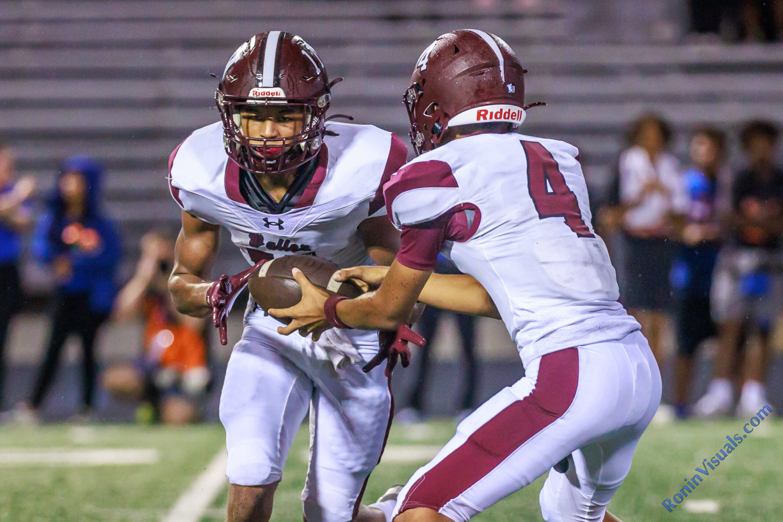 Freshman quarterback T.K. Gaines (4) hands the ball off to Robert Carter (11) during the trick play that netted the Bulldogs their second touchdown of the night. The Waller Bulldog football team slips against Conroe Grand Oaks, 17-14, for the Bulldog’s first loss of the 2024 campaign, at Moorehead Stadium in Conroe, Sept. 5, 2024. (Photo by Creighton Holub, courtesy RoninVisuals.com)