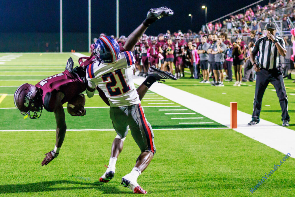 Waller freshman Makhy Adams catches a short touchdown pass on top of a Cy Springs defender. The Waller Bulldogs defeat Cy Springs’ Panthers, 73-48, at Daikin Stadium in Waller, Texas, on Friday, Oct. 9, 2026. (Photo by Alberto Mata Jr., © 2026 Ronin Visuals, all rights reserved.)